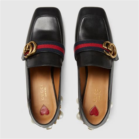 gucci heeled loafer.